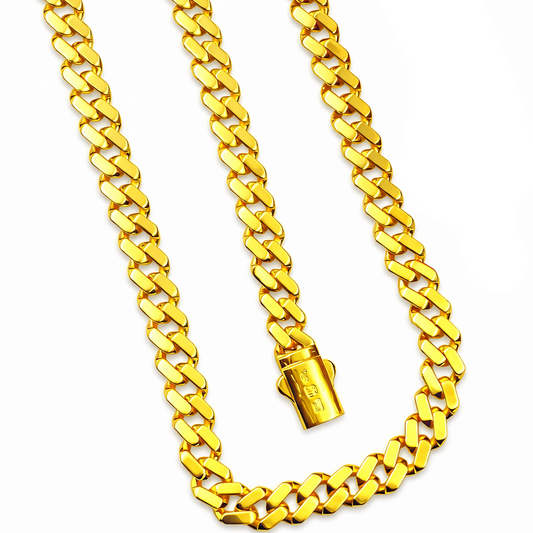 Gold chain necklace on a white background