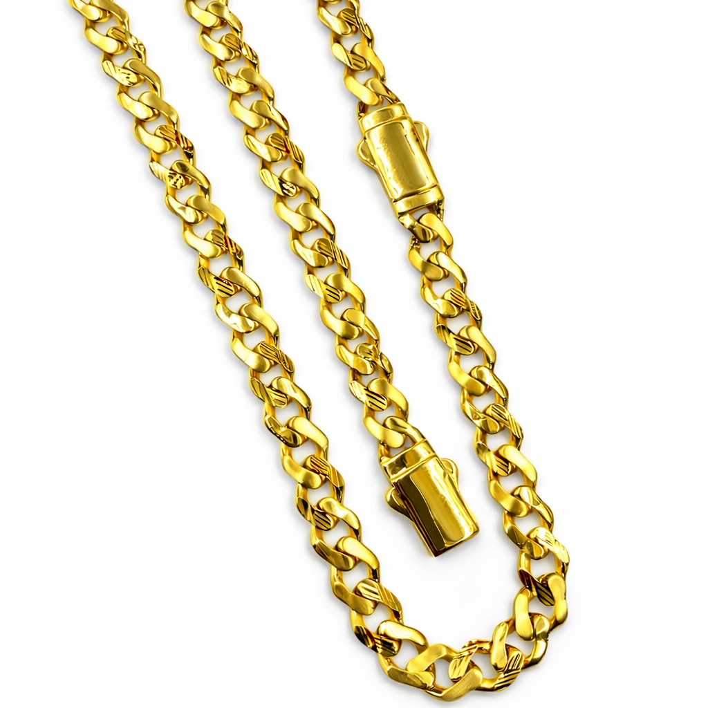 Gold chain necklace with clasp on a white background
