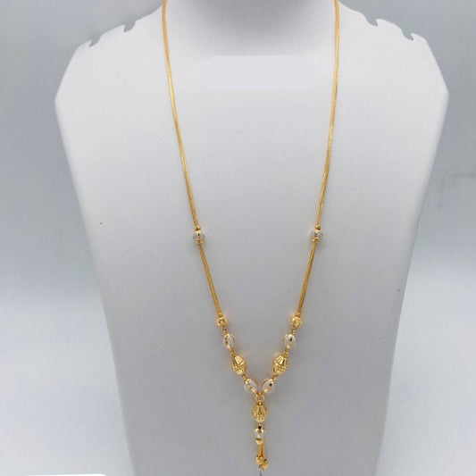 Gold necklace on a mannequin bust with weight displayed