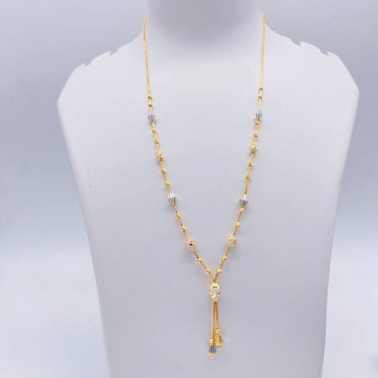 Gold necklace on a white mannequin bust with weight indication