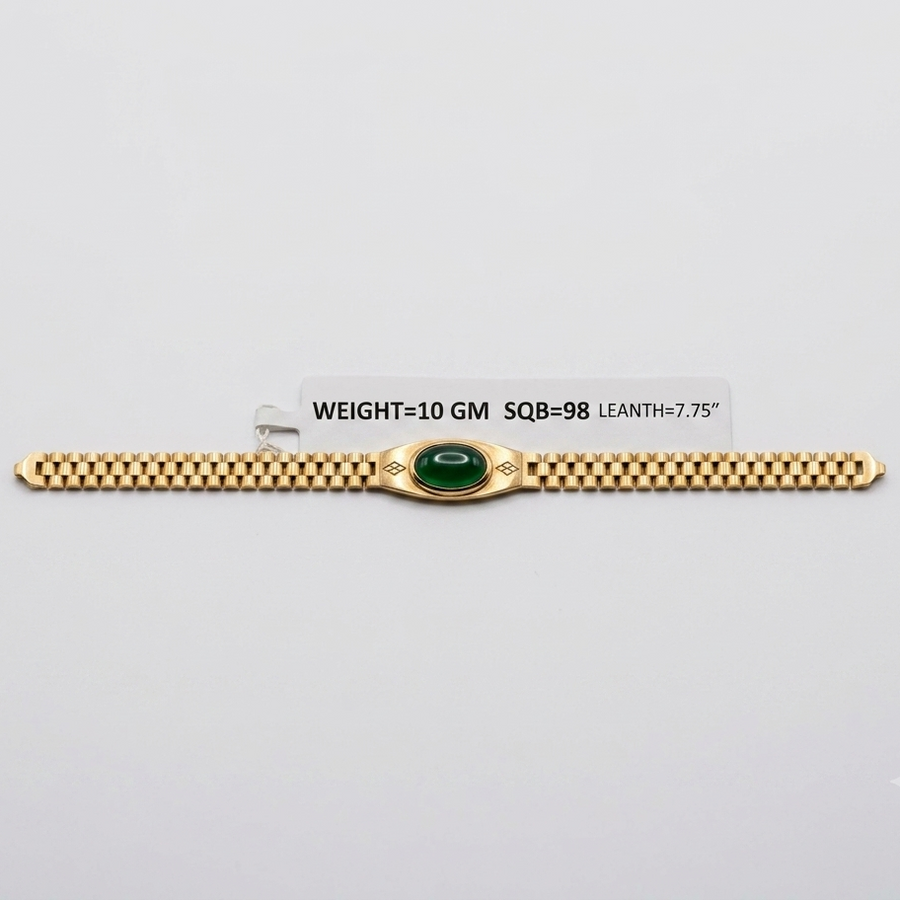 A gold bracelet with a central green oval stone and decorative side details, displayed on a light gray background with a small label showing weight and dimensions.