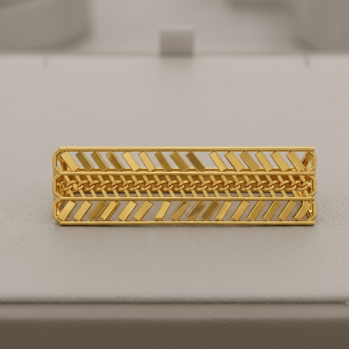 A gold rectangular ring with a textured chevron and woven pattern, displayed on a light gray jewelry box.