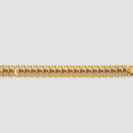 A gold-toned metal link bracelet with a repeating geometric pattern, displayed horizontally against a light gray background.
