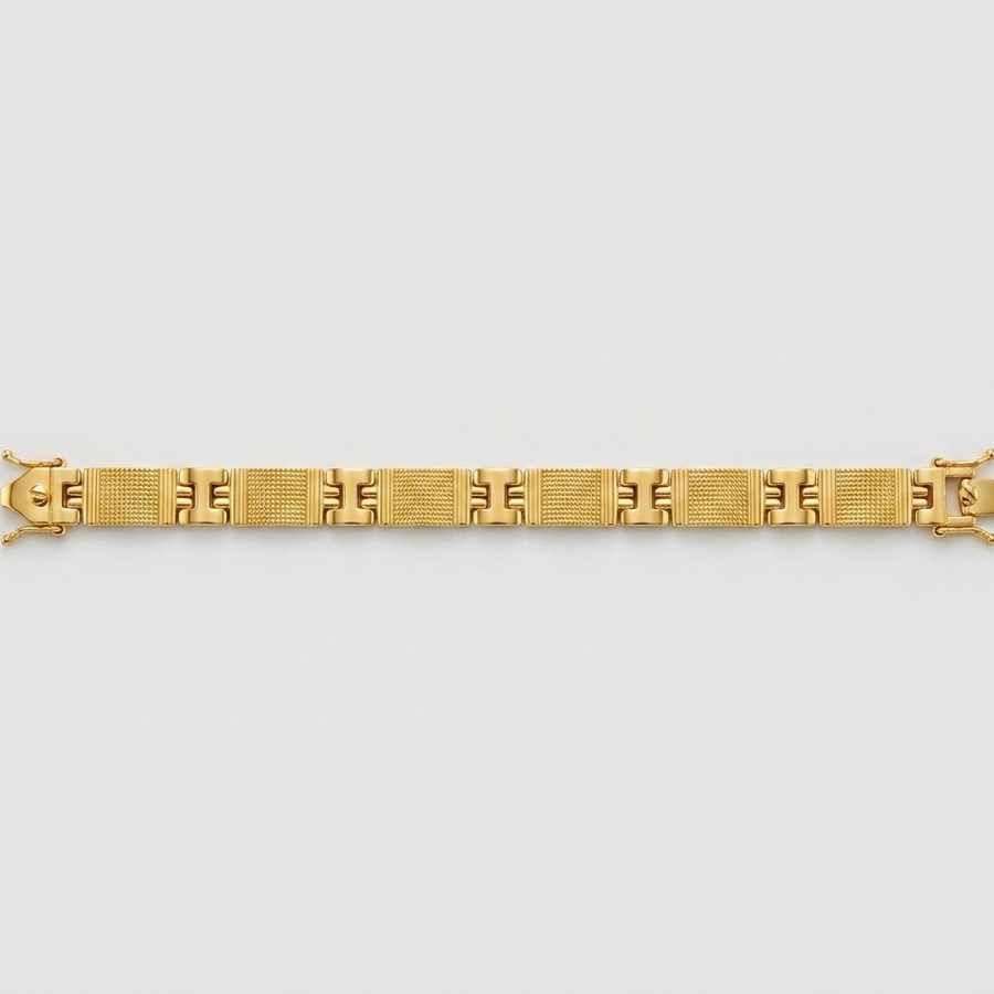 A gold link bracelet with a geometric pattern, displayed horizontally against a light gray background.