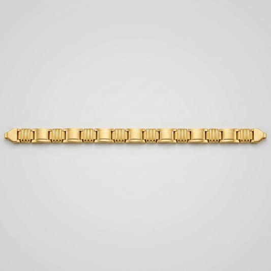 A gold tennis bracelet with a distinctive fluted or ribbed link design, displayed horizontally against a clean, light gray gradient background.