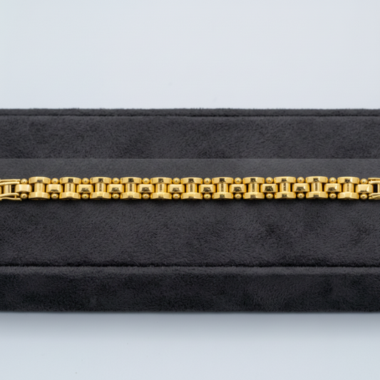 A yellow gold bracelet with turquoise blue bezel-set round stones, displayed horizontally on a black velvet jewelry box. The image includes a text overlay with specifications: 'WEIGHT=11 GM LEANTH=8" WIDTH=7 MM FCB-085 12KT'.
