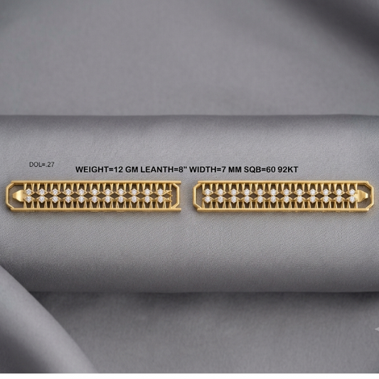 Two gold-plated diamond bands shown on a gray fabric background, with text detailing the specifications: 'DOL=27 WEIGHT=12 GM LEANTH=8" WIDTH=7 MM SQB=60 92KT'.
