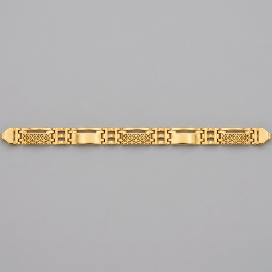 A gold link bracelet with a combination of polished rectangular links and textured geometric patterns, displayed horizontally on a solid gray background.