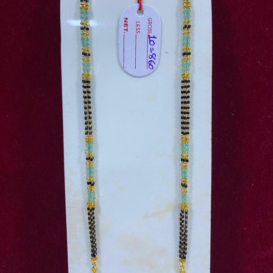Two beaded necklaces on a white stand with a red background