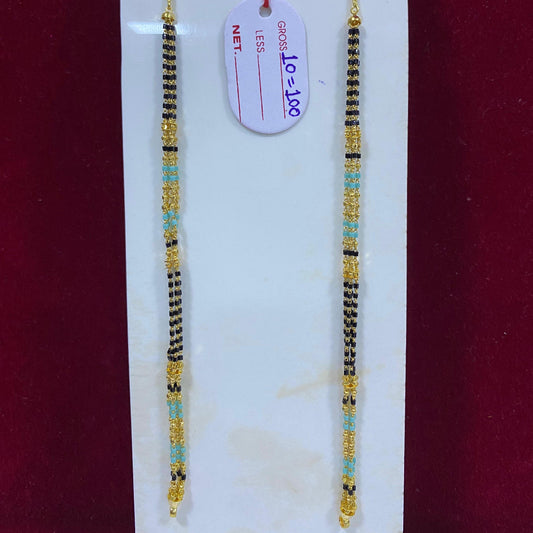 Two beaded bracelets on a white card with a red background