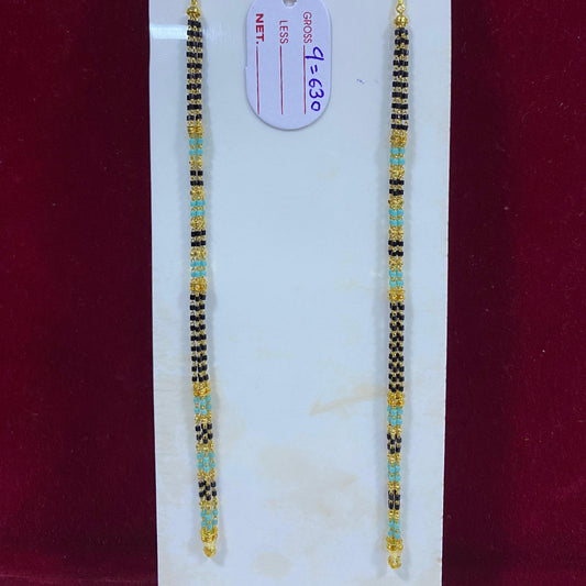 Two beaded bracelets on a white card with a red background