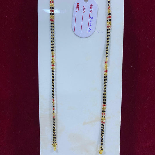 Two beaded necklaces on a white card with a red background