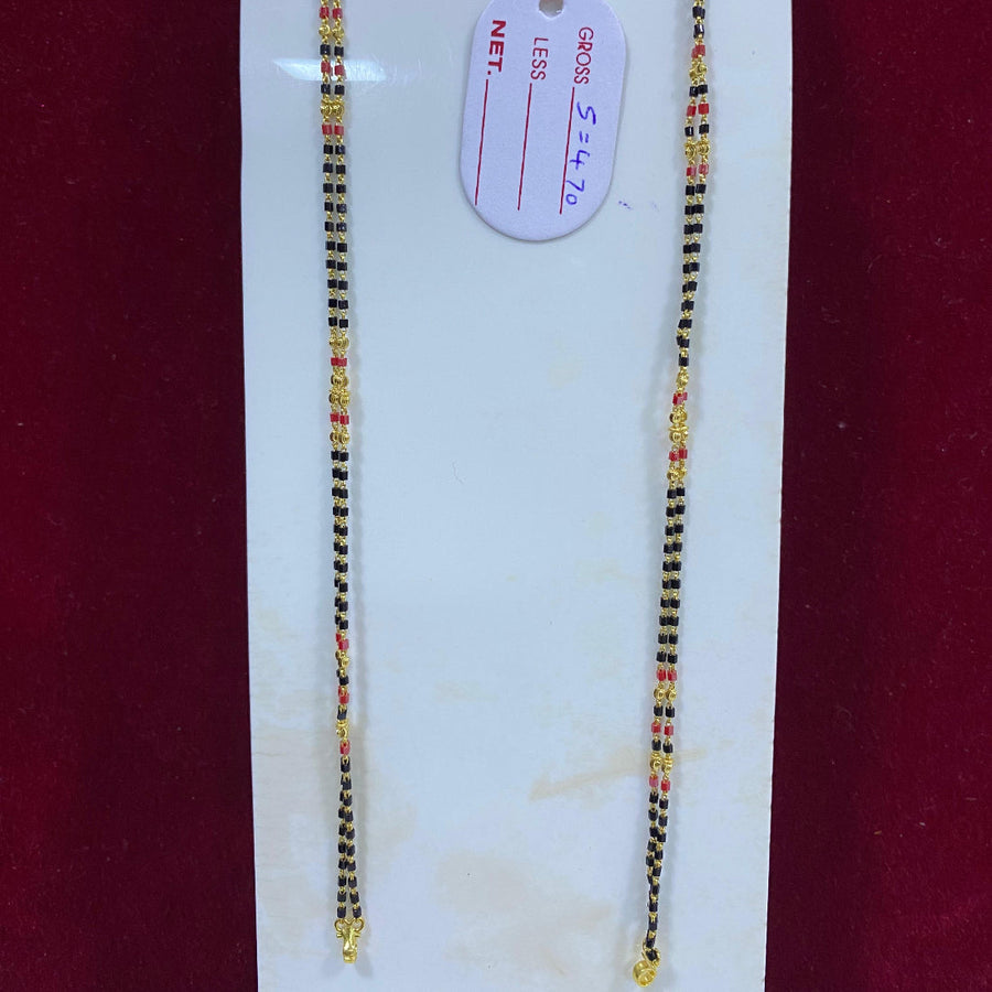 Two beaded necklaces on a white card with a red background