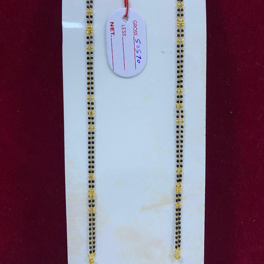 Two gold chains on a white card with a red background