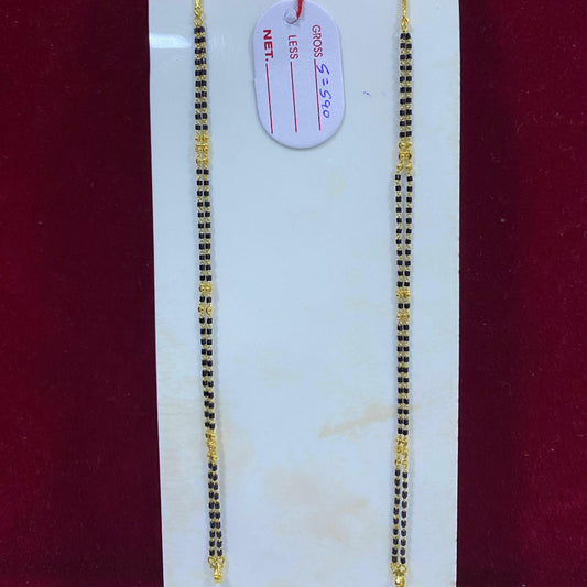 Two gold chains on a white card with a red background