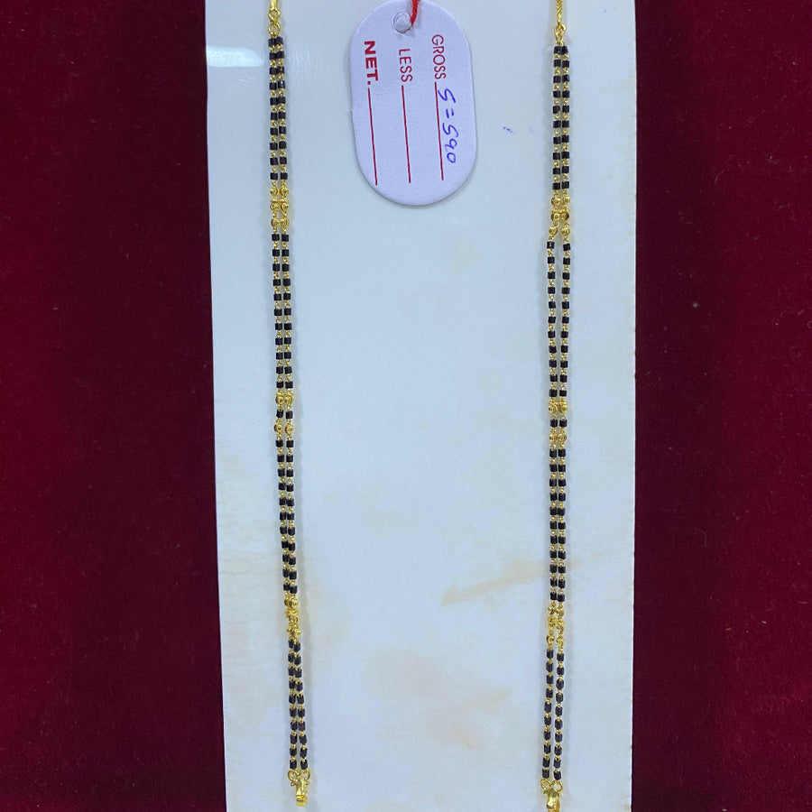 Two gold chains on a white card with a red background