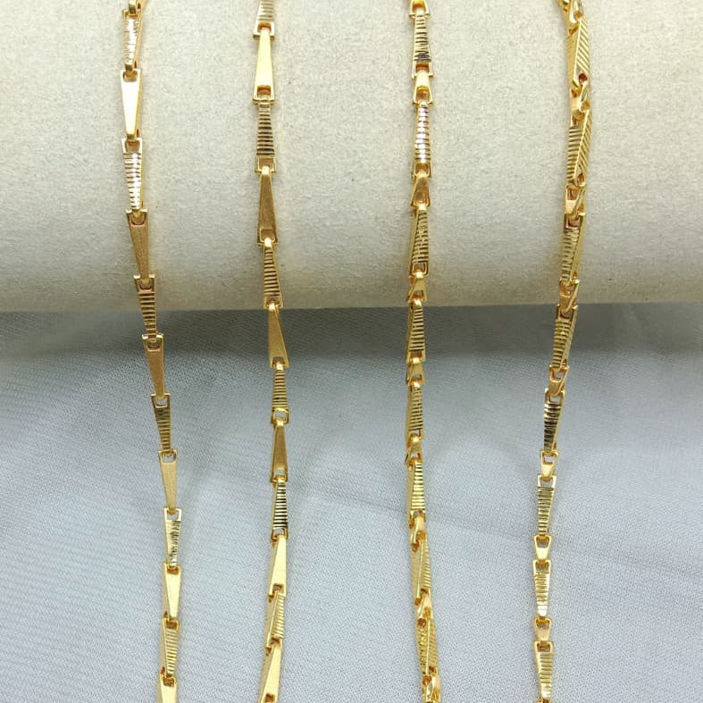 Gold chain necklace on a gray surface with weight and length information.