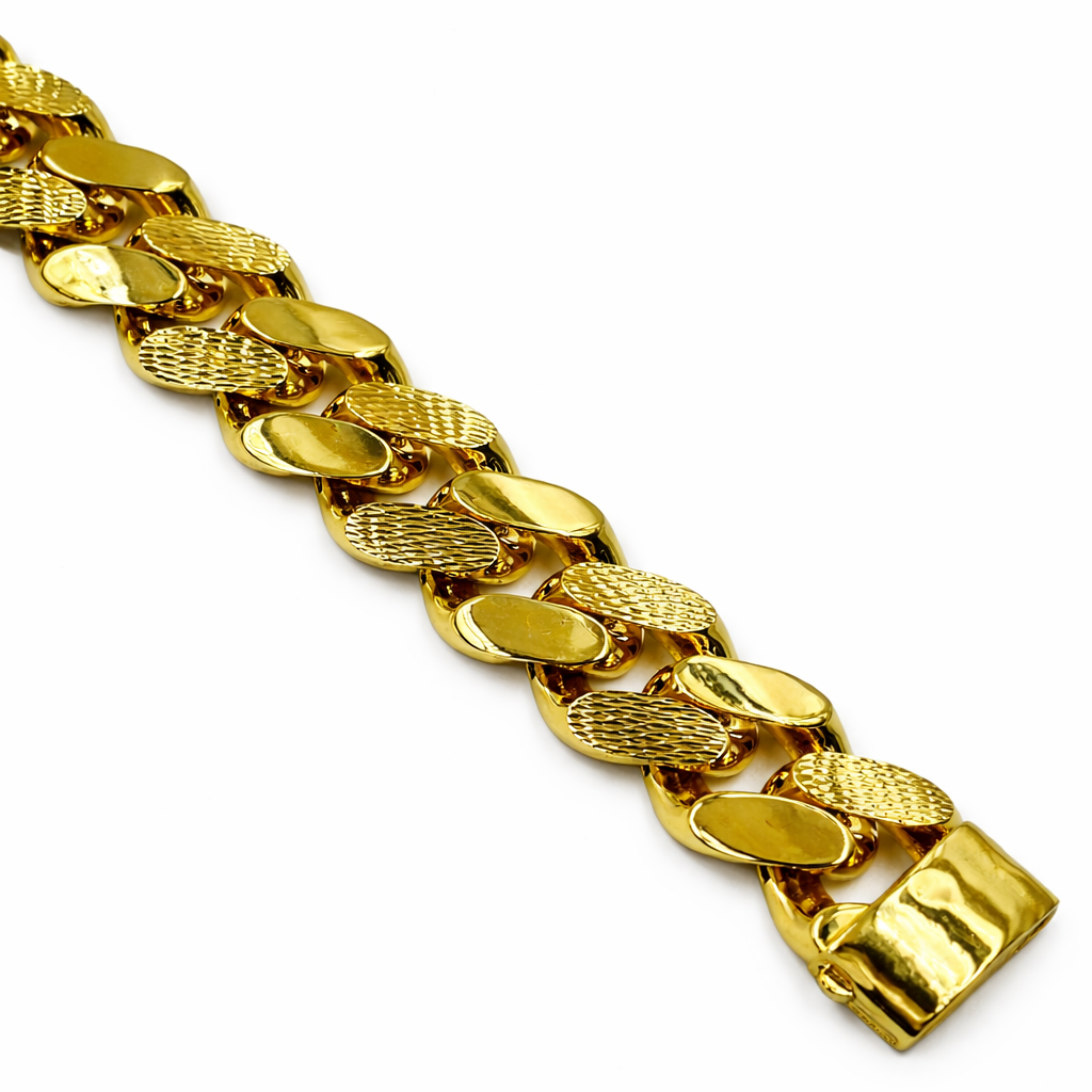 Gold chain bracelet on a white background
