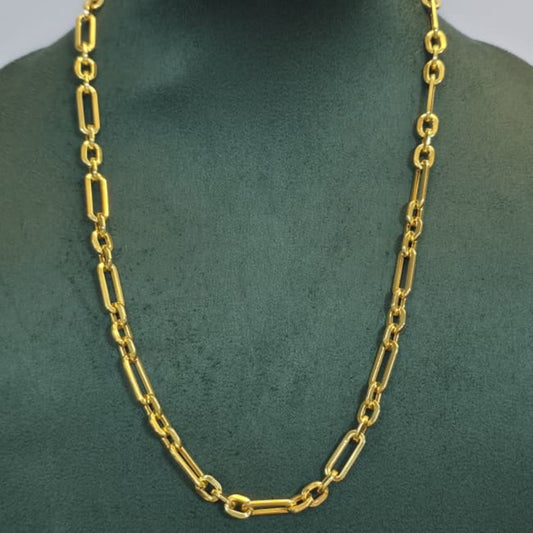 A gold chain necklace with elongated oval links displayed on a dark green jewelry bust against a light gray background.