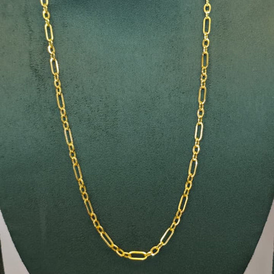 A gold paperclip chain necklace displayed on a dark green velvet jewelry bust against a light gray background.