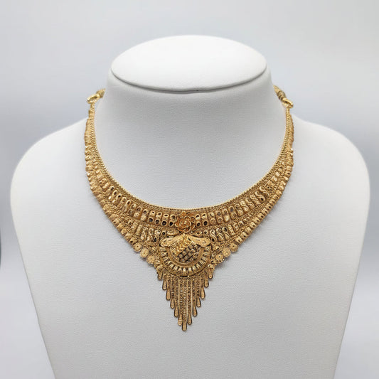 Gold necklace on a mannequin with weight displayed