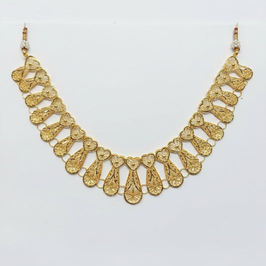 Gold necklace on a clear plastic bag with a price tag.